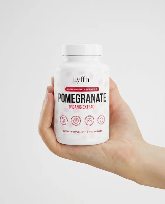 Organic Pomegranate Extract Capsules held in one hand