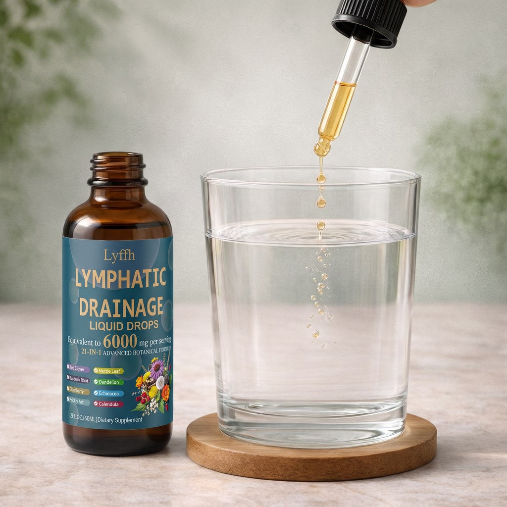 A dropper of Lymphatic Drainage Drops above a glass of water