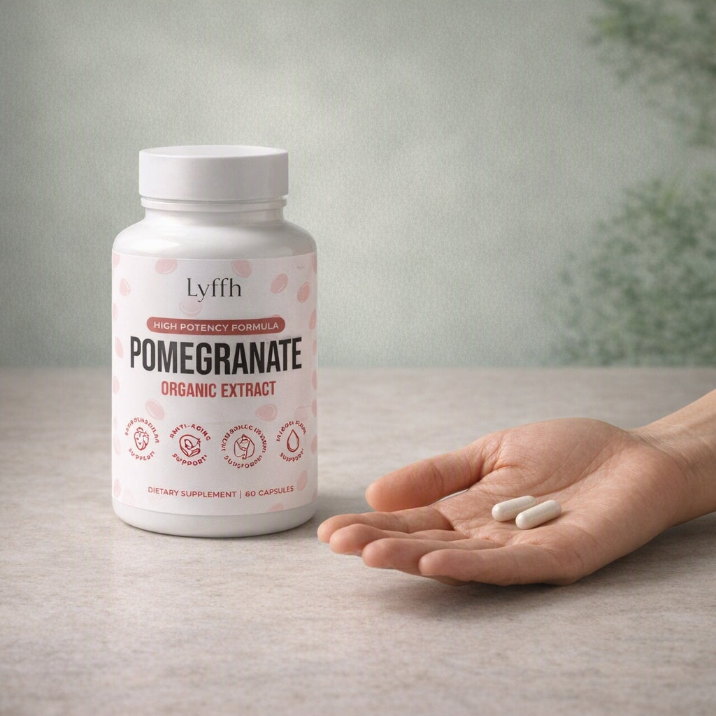 Organic Pomegranate Extract Capsules bottle beside a hand holding two capsules